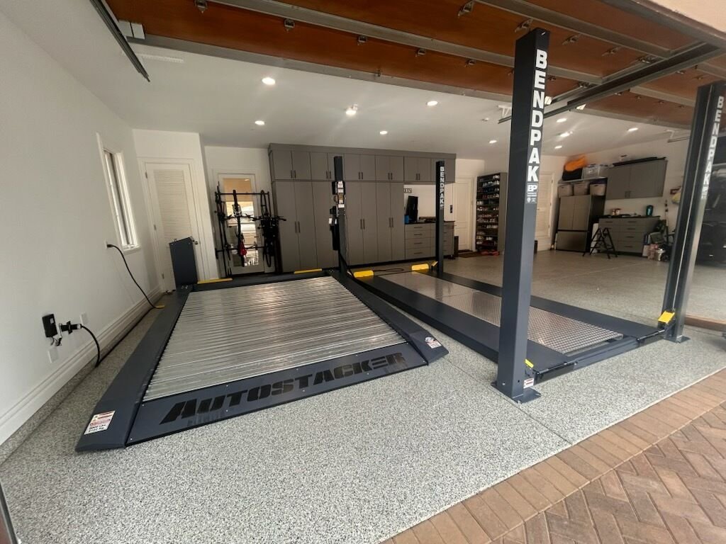 Automotive lift with drive-on ramps in custom garage